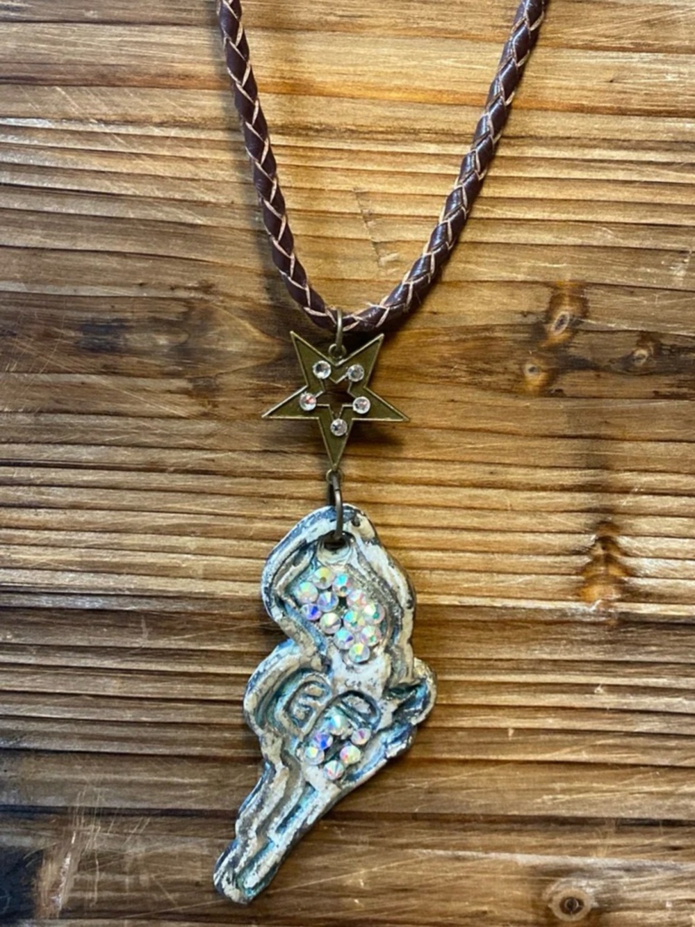Western inspired, Rare Bird Pistol necklace. Long leather cord chain.